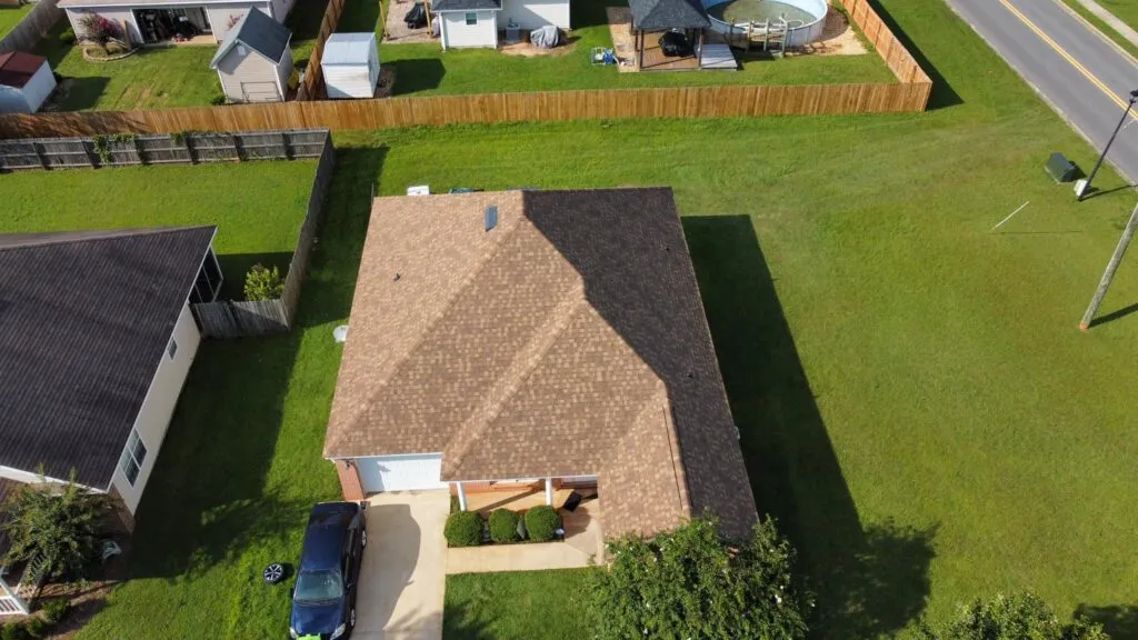 A completed shingle roof documented from above during an inspection