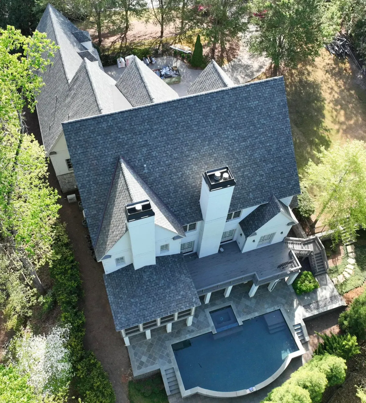 Steep-slope residential roof replacement in progress
