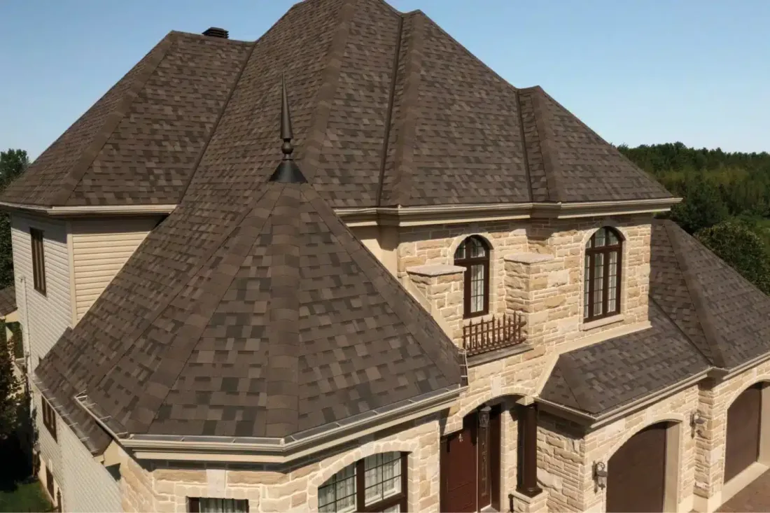 A home roofed in dimensional architectural asphalt shingles